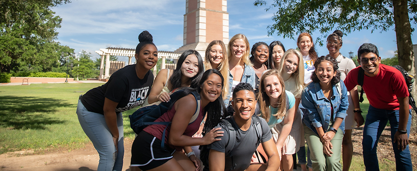 Students standing in front of Moulton Tower on campus.